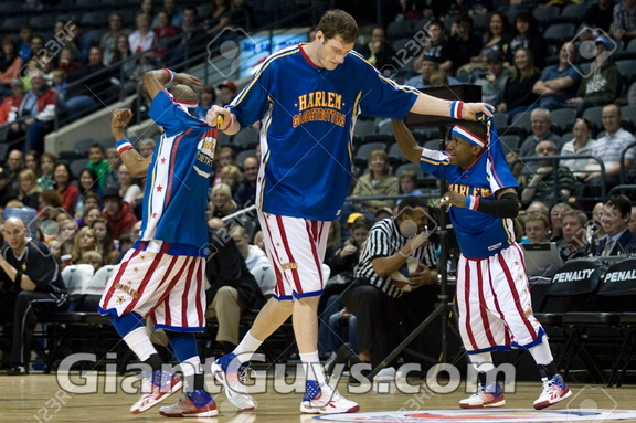 13182076-London-Ontario-Canada-April-14-2012-Paul-Tiny-Sturgess-centre-helps-Jonte-Too-Tall-Hall-and-Tay-Fire-Stock-Photo