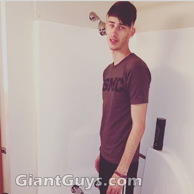 Giant tall boy in shower