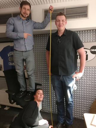 7ft2 tall guy Lukas getting measured