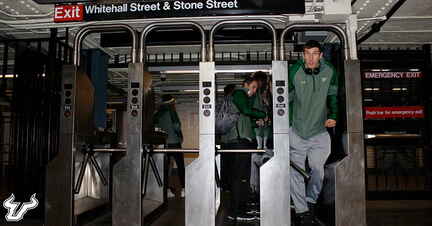 Ruben Guerrero squeezes through the subway turnstile