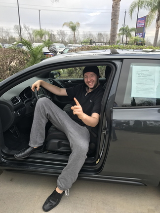 6'7 me getting in my VW.